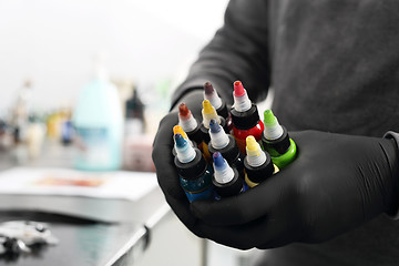 Image showing Color ink tattoo Tattoo studio, preparing ink Black tattoo inks. Color ink tattoo. Worktop in the tattoo studio