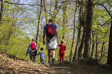 Image showing Parents with children walking by hiking trail