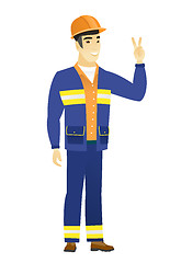 Image showing Asian builder showing the victory gesture.