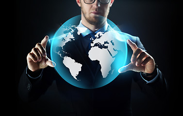 Image showing close up of businessman with earth projection