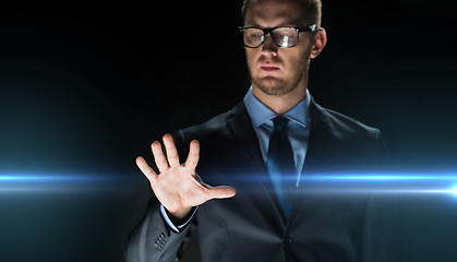 Image showing businessman touching something imaginary