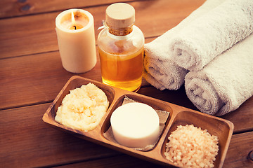 Image showing close up of natural cosmetics and bath towels