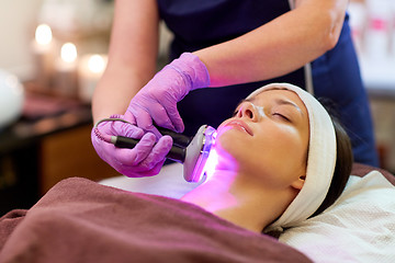 Image showing young woman having face microdermabrasion at spa