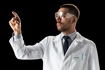 Image showing doctor or scientist in lab coat and safety glasses