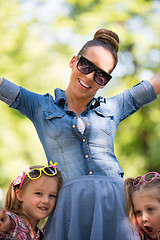 Image showing mother with her daughters in the park