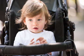 Image showing baby girl sitting in the pram