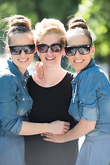 Image showing portrait of three young beautiful woman with sunglasses