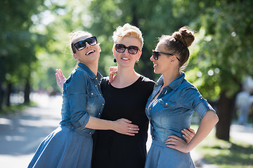 Image showing portrait of three young beautiful woman with sunglasses