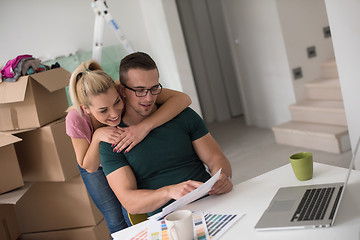 Image showing Young couple moving in a new home