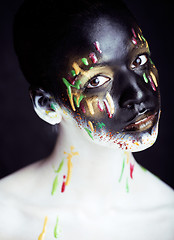 Image showing woman with creative makeup closeup like drops of colors, facepai