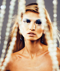 Image showing beauty young snow queen in fairy flashes with hair crown on her 