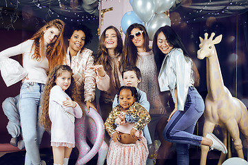 Image showing Lifestyle and people concept: young pretty diversity nations woman with different age children celebrating on birth day party together happy smiling, making selfie. African-american, asian and caucasi