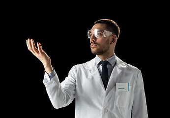 Image showing doctor or scientist in lab coat and safety glasses