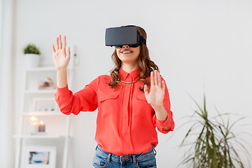Image showing happy woman in virtual reality headset at home