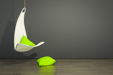 Image showing hanging armchair with green pillows