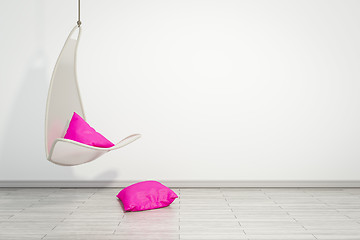 Image showing hanging armchair with pink pillows