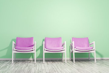 Image showing armchairs green wall