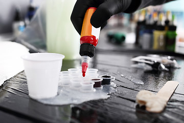 Image showing Color ink tattoo. Worktop in the tattoo studio