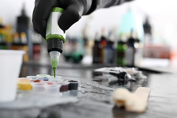 Image showing Tattoo studio, preparing ink Black tattoo inks.