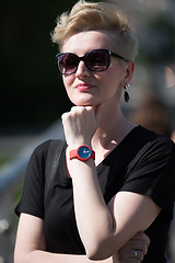 Image showing young woman with short blond hair and sunglasses