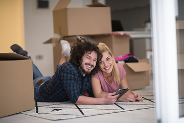 Image showing Young couple moving in a new flat