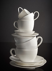 Image showing stack of white coffee cups and plates