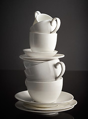 Image showing stack of white coffee cups and plates