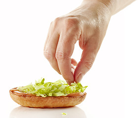 Image showing process of making burger