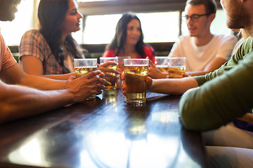 Image showing friends drinking beer at bar or pub