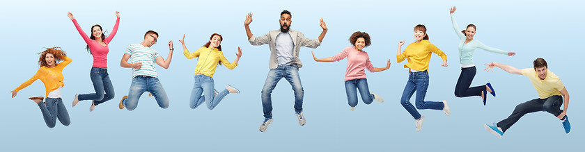 Image showing international group of happy people jumping