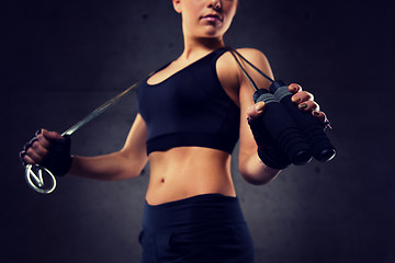 Image showing close up of sporty woman with jumping rope