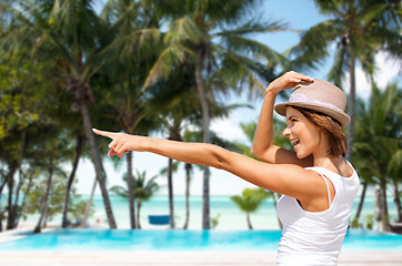 Image showing happy young woman in hat on summer beach