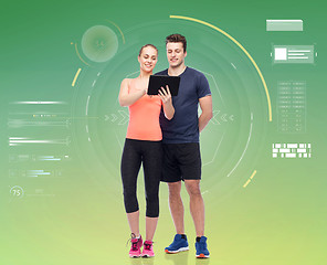 Image showing happy sportive man and woman with tablet pc