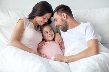 Image showing happy family in bed at home