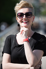 Image showing young woman with short blond hair and sunglasses