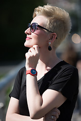 Image showing young woman with short blond hair and sunglasses