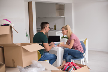 Image showing Young couple moving in a new home