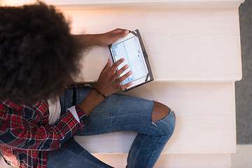 Image showing black woman using her electronic tablet