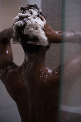 Image showing African American woman in the shower