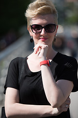 Image showing young woman with short blond hair and sunglasses