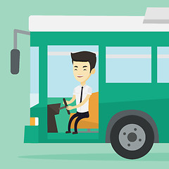 Image showing Asian bus driver sitting at steering wheel.