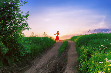 Image showing Young Woman Dancing Against The Setting Sun