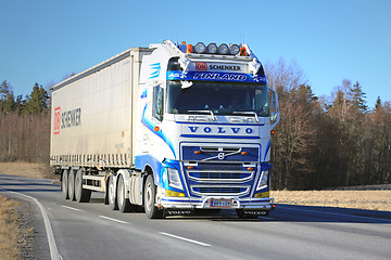 Image showing Blue and White Volvo FH Semi Truck Transport at Spring