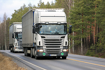 Image showing Two White Scania R420 Semi Trailer Trucks on the Road