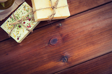 Image showing close up of handmade soap bars on wood