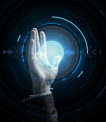 Image showing businessman hand with virtual projection
