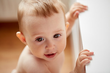 Image showing happy little baby boy or girl at home