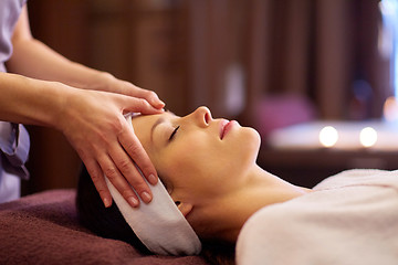 Image showing woman having face and head massage at spa