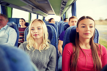 Image showing happy young women riding in travel bus