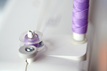 Image showing thread spools on sewing machine